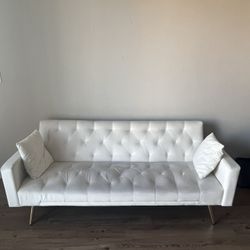 White Couch with throw pillows 