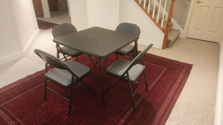 Folding table and 4 Folding chairs.
