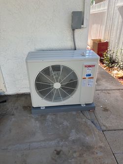 Split-system heating and cooling air conditioner