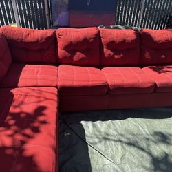 Red couch with pullout bed good condition clean we sell all the time delivery $40 local