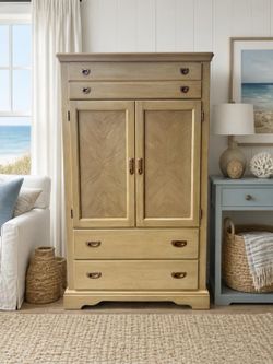 Coastal warm wood armoire cabinet