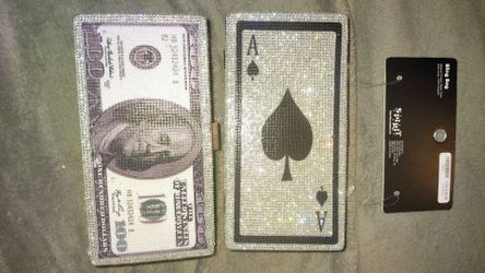 $100 bill in Ace card boxes