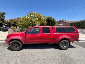 2004 Nissan Frontier XE-V6 4x4 with the camper shell