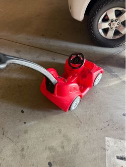 Kids push on car