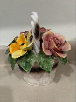Med vase of capodamente multi colored flowers