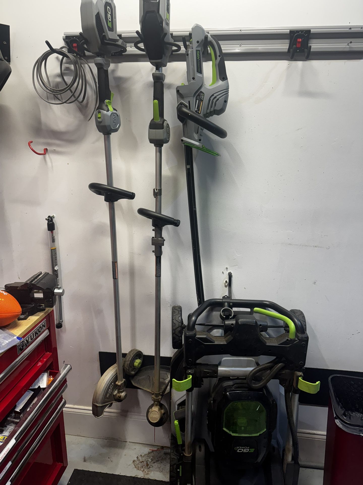 EGO Battery Powered Lawn Mower, Trimmer, Weed Eater, and Edger. Comes with 2 batteries and charger