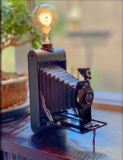 Vintage kodak foldout camera lamp.