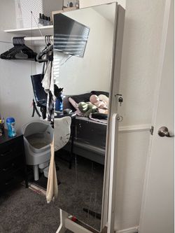 Mirror with jewelry storage