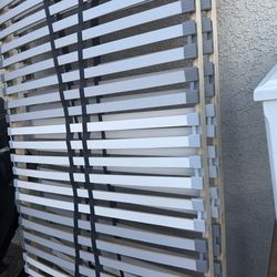 It’s a sturdy wooden bed frame. 79 inches high x 76 inches wide.