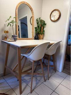 IKEA high dining table with two chairs