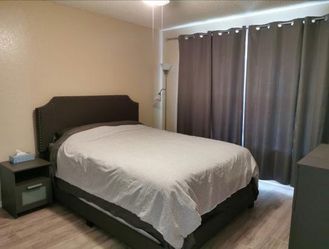 Queen Upholstered Bed Frame – Gray Fabric Headboard – Excellent Condition