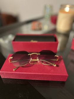 l:I Cartier gold and purple sunglasses