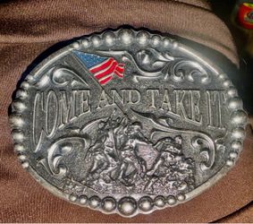 New no box a Andwest. Come and lake It. belt buckle featuring an antique silver finish, embossed scrolling, and an enameled American flag accent loca