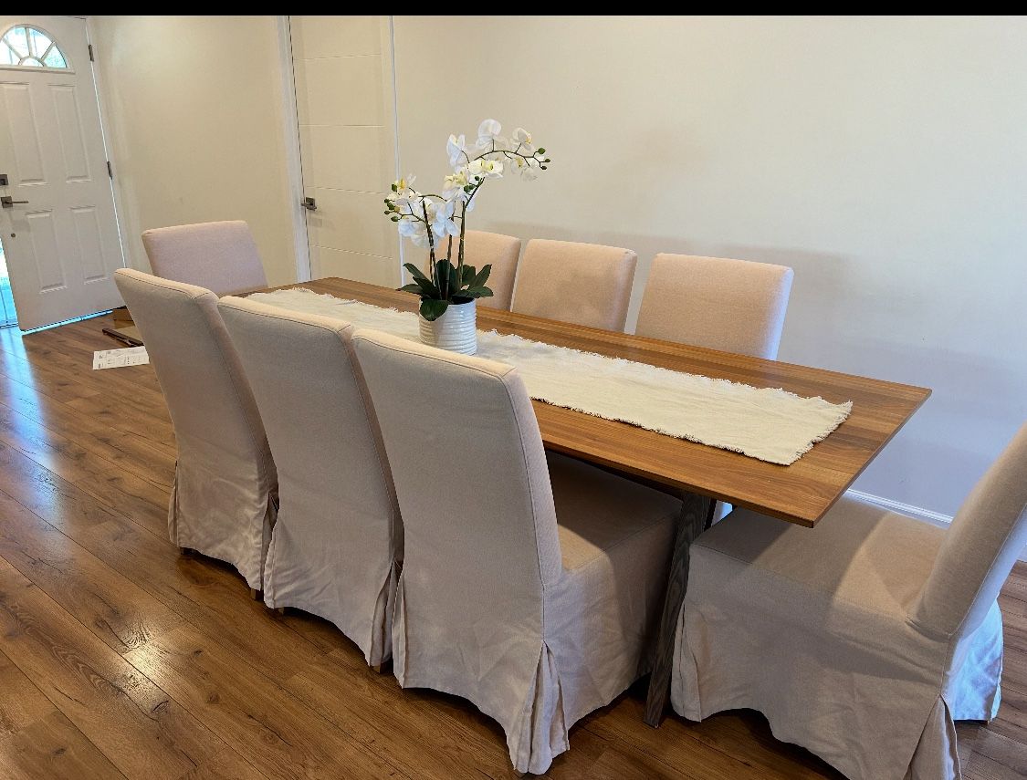 Classic IKEA dining table with its matching 8 chairs