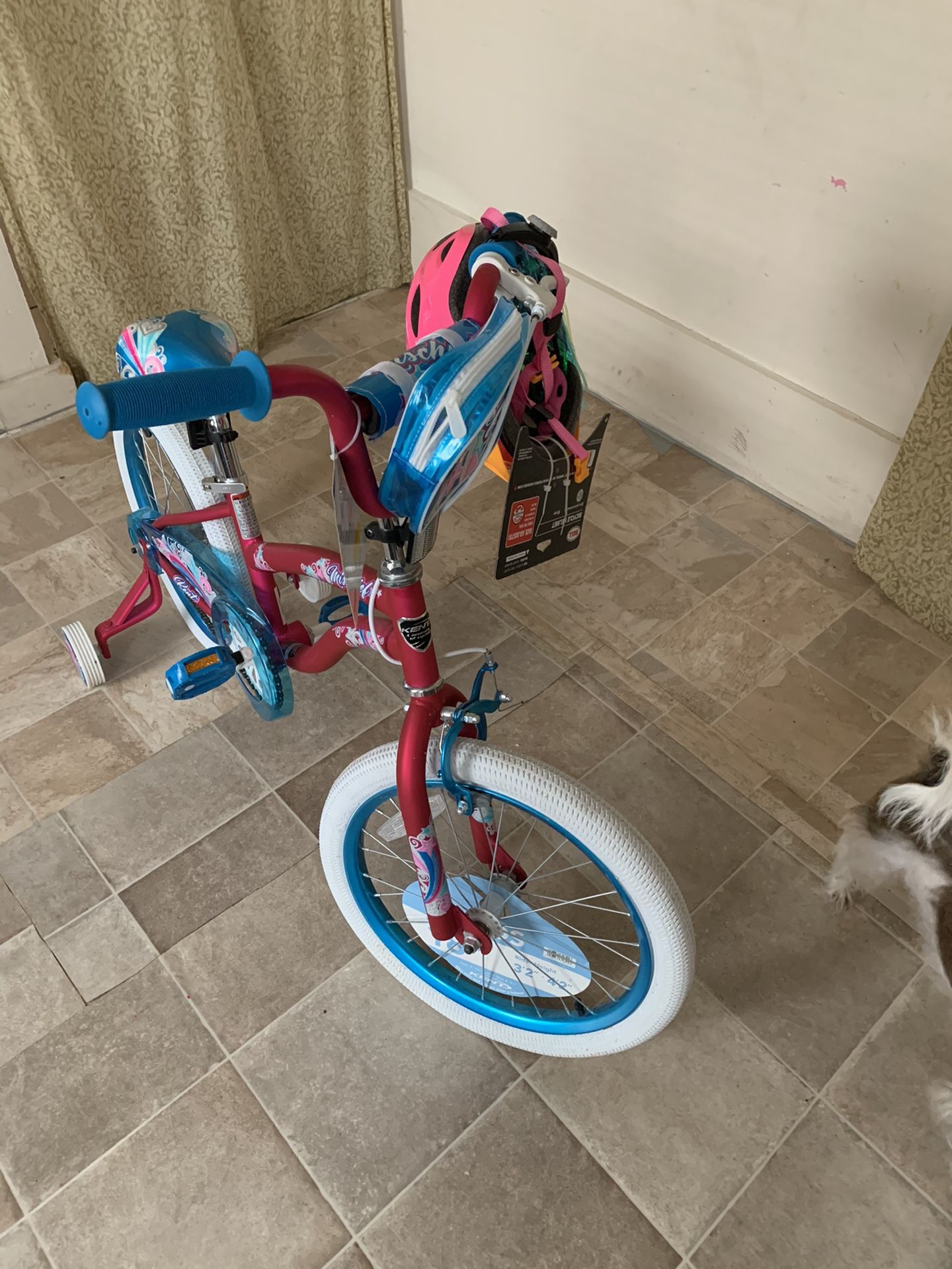 NEW! KENT, Girls bike never been used, it has training wheels and a helmet.