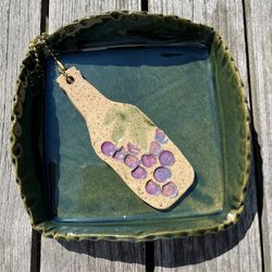 GLAZED CERAMIC NAPKIN HOLDER W/ CERAMIC WINE BOTTLE WEIGHT