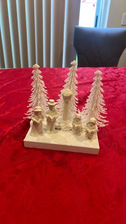 Christmas Caroler family singing white Christmas trees with snow and glitter decorations