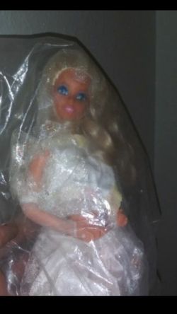 Wedding Barbie with ring, bouquet, shoes and of course Dress.