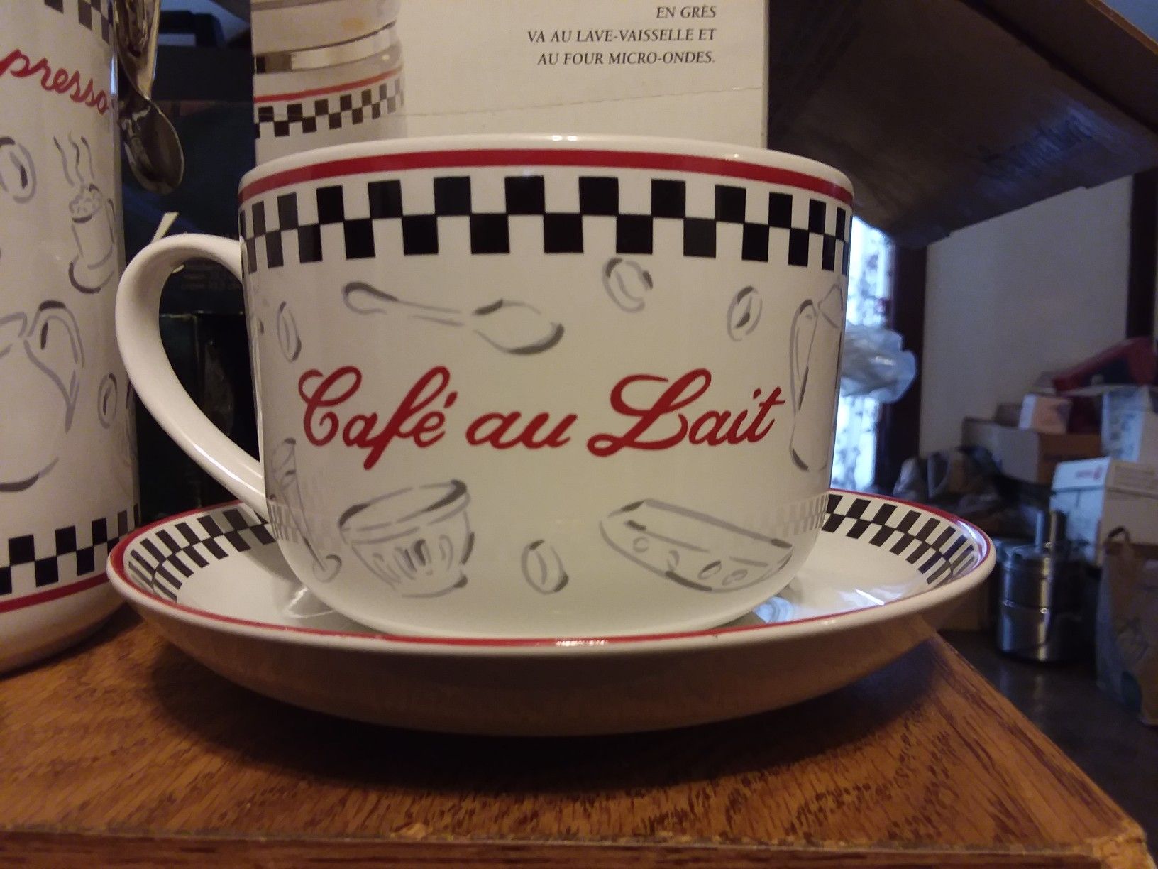 Coffee cups with saucers and coffee canister.
