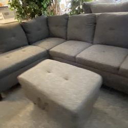 New Left Face Chaise Grey Sectional With Storage Ottoman! 9x7 Must Sell Can Deliver 
