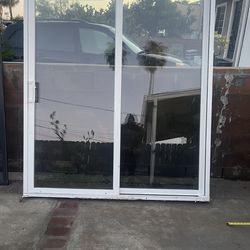 Slidding door, vinyl material, double glass  Height 80 inches Width 70 inches  Used in good condition  Located in sun valley ca 91352