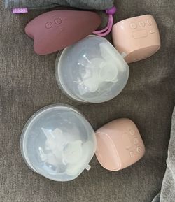 Breast pump and a lactation massager