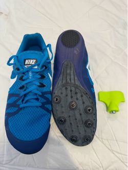 Blue Nike running shoes with spikes