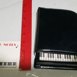 Cute piano notebook holder with notes
