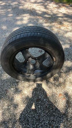 235/55R18 tire and 5-lug wheel