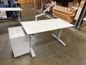 Complete home office includes high end sit to stand desk, 27 x 53” monitor and locking storage mobile pedestal with drawers