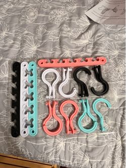 Multi-colored plastic hooks and clips for organizing