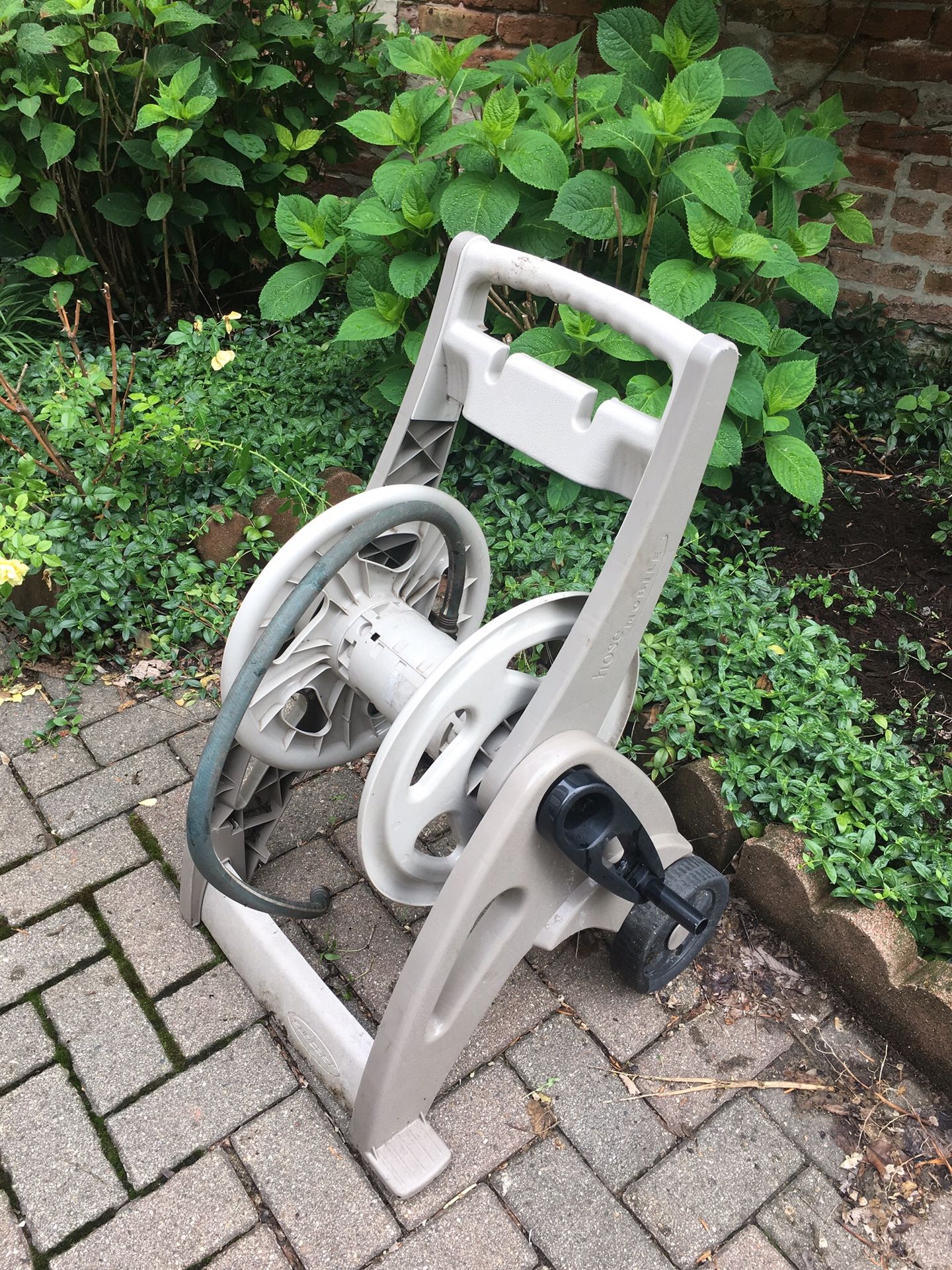 Rolling garden hose cart