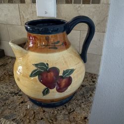 ceramic jug with a picture of apples