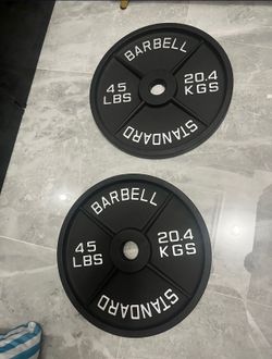 New in box pair of 45lb Olympic weight plates total 90lb
