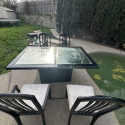 dining table with chairs, with a mirrored surface