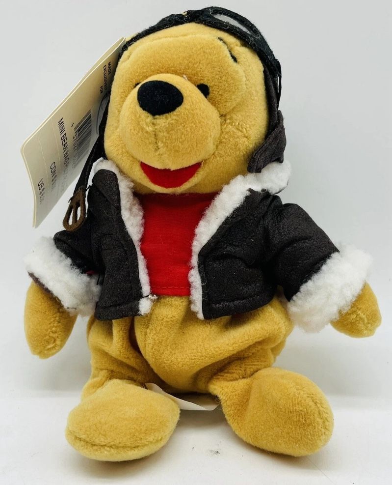 The Disney Store 8” Mini Bean Bag Pilot Pooh. Brand New with Tags and In Package. $20.00 Each.
