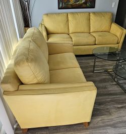Presenting a pristine, exquisite two-piece sofa set, meticulously crafted from 100% microfiber in the captivating "Butterfly Marigold" hue. This is th