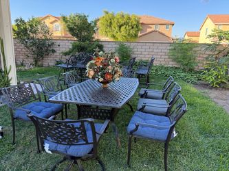 set of heavy cast iron table plus 8 chairs