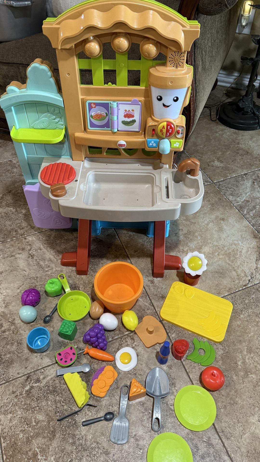 Fisher-Price toddler Laugh & Learn Grow-the-Fun Garden to Kitchen playset