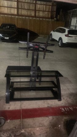 3teir glass tv stand with a 50 inch mount