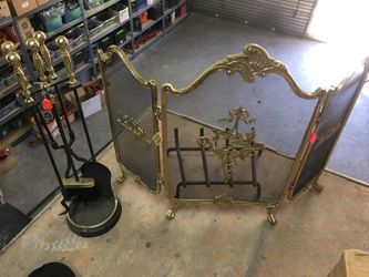 Gold and black fireplace cover and accessories