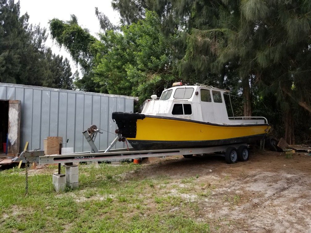 25 ft kencraft on a 30ft magicloader aluminum trailer 2000 dollars.