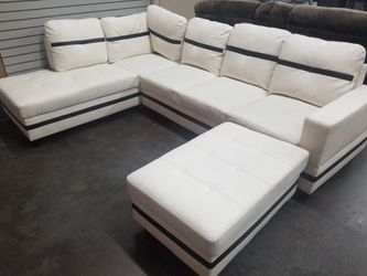 Contempory white sectional with ottoman. Floor clearance asis