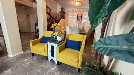 Beautiful set of two nailhead trim arm accent chairs ( color yellow )