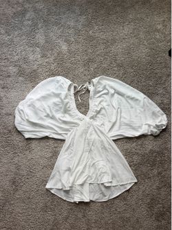 White dress with puffy sleeves and tie back