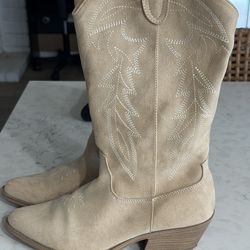 Light beige suede cowgirl boots.