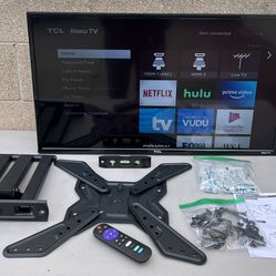 smart TCL Roku TV with a wall mount kit.