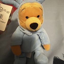 Winnie The Pooh Dressed As Blue Bunny.