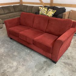 Red Couch “WE DELIVER”