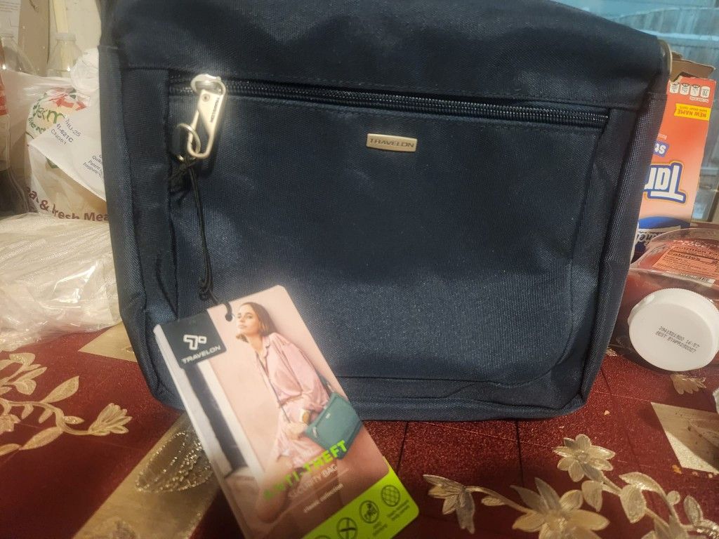 A compact crossbody with a built-in 5-Point Anti-Theft security system to protect your valuables.